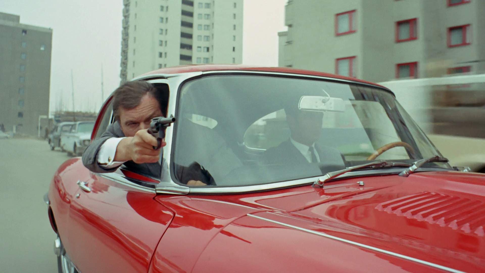 Photo d'illustration du film Jerry Cotton - Der Tod im roten Jaguar